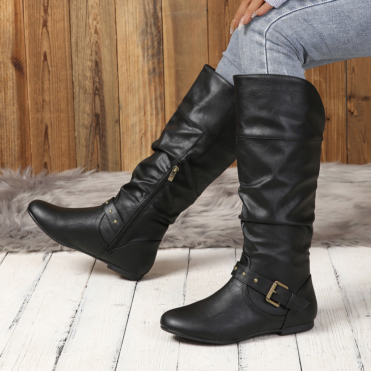 Women's black faux leather slouchy knee high boots with buckles and side zipper