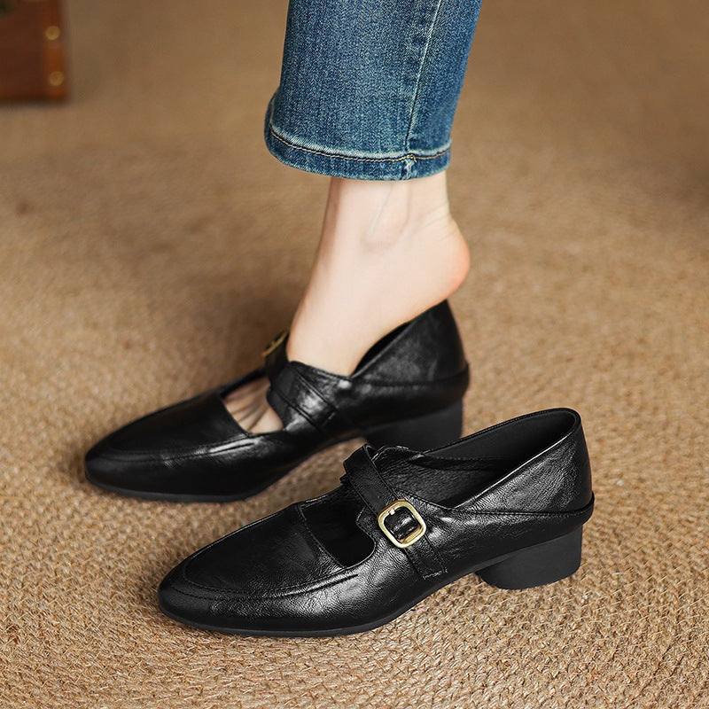 black Women's classic Mary Jane pumps with gold buckle
