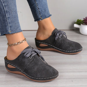 Women's closed toe low wedge mules