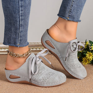 Women's closed toe low wedge mules