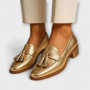 Women's gold metallic loafers with tassels