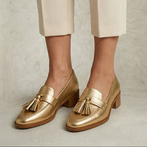 Women's gold metallic loafers with tassels