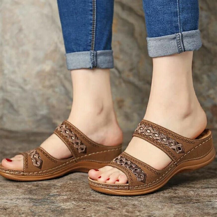 Women hollow out two strap 
wedge slide sandals