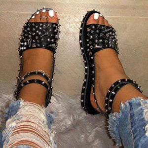 Women studded flat peep toe 
ankle strap black sandals